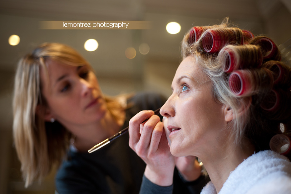 bride being made up in hotel room in new forest hampshire