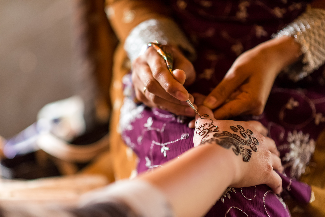 mehndi being applied on hands
